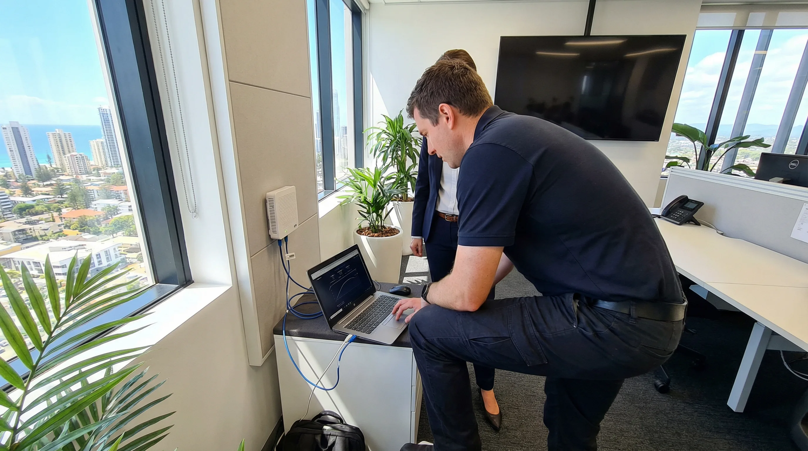 NBN internet support on-site technician Gold Coast — testing connection at business premises